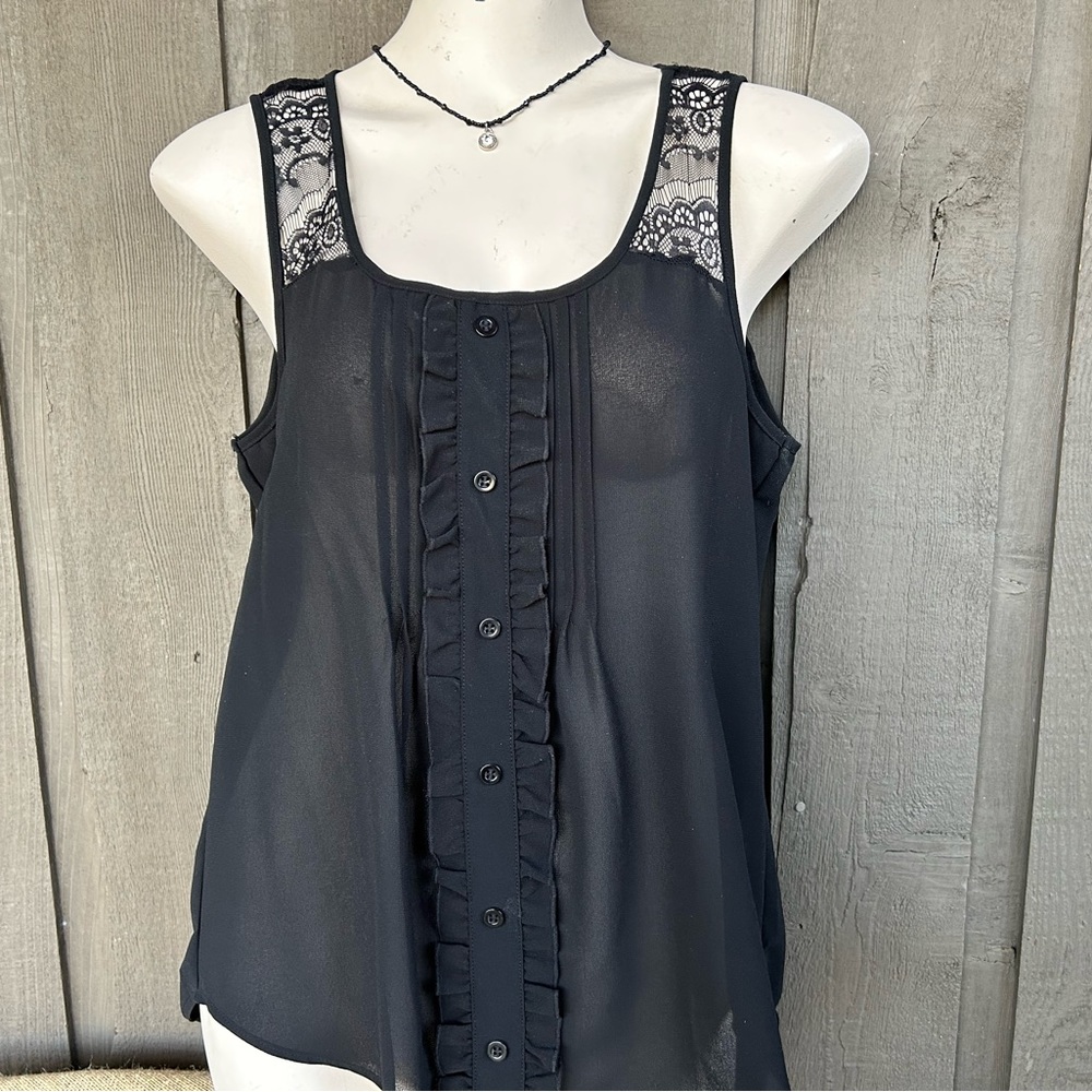 Black sheer with lace top part and ruffled button part.